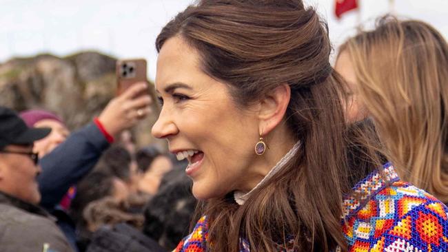 Denmark's Queen Mary (R) meets with local residents upon arriving in Sisimiut, Greenland, on July 2, 2024. The royal couple officially visits Greenland from the 29th of June to the 6th of July 2024. (Photo by Ida Marie Odgaard / Ritzau Scanpix / AFP) / Denmark OUT