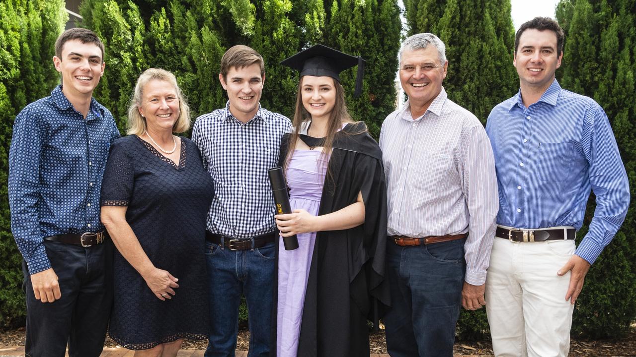 Bachelor of Business and Bachelor of Commerce graduate Katelyn Beresford with (from left) Bailey Beresford, Helen Beresford, Jacob Luck, Tony Beresford and Darcy Beresford at the UniSQ graduation ceremony at Empire Theatres, Tuesday, December 13, 2022. Picture: Kevin Farmer