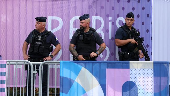 PARIS, FRANCE - JULY 24: Armed Police are seen on the streets outside the stadium prior to the Men's group D match between Mali and Israel during the Olympic Games Paris 2024 at Parc des Princes on July 24, 2024 in Paris, France. (Photo by Maja Hitij/Getty Images)