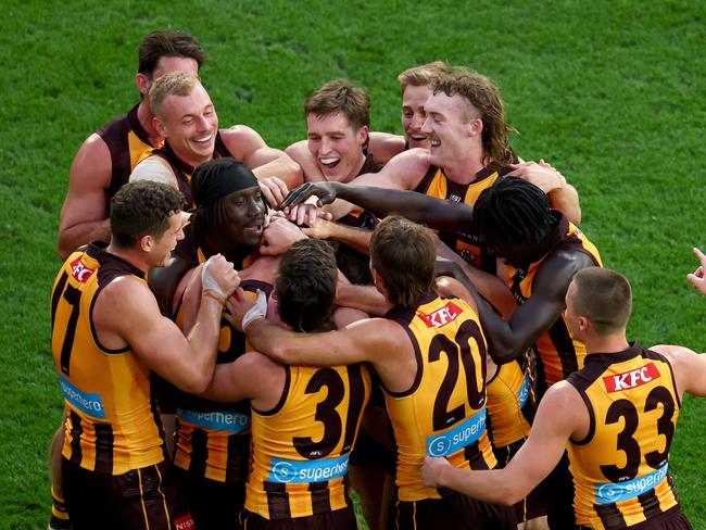 Jack Gunston is mobbed after kicking his 500th game. Picture: Josh Chadwick/AFL Photos/via Getty Images.