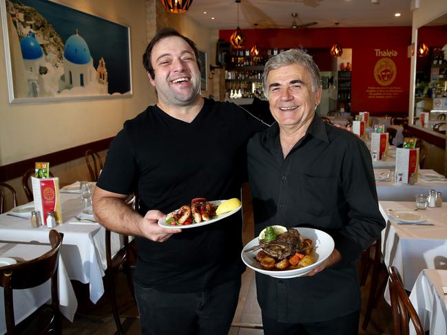 Owner Josip Devcic (L) pictured with an entree of octopus and waiter Lambros Kortikis (R) with a main course of lamb. Picture: Toby Zerna