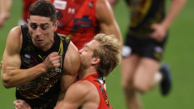 PERTH, AUSTRALIA – JUNE 05: Darcy Parish of the Bombers tackles Jason Castagna of the Tigers during the round 12 AFL match between the Essendon Bombers and the Richmond Tigers at Optus Stadium on June 05, 2021 in Perth, Australia. (Photo by Paul Kane/Getty Images)