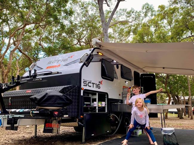 Cameron and Chloe Soper outside their caravan at Cathedral Beach.