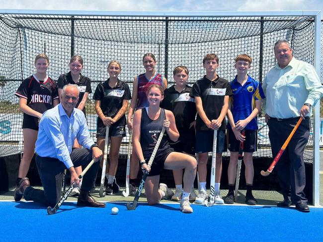 Mackay LNP candidate (front left) and Member for Dawson Andrew Willcox (front right) pose with members of Hockey Mackay after announcing $800,000 in funding for a new indoor facility. Picture: Hockey Mackay Facebook