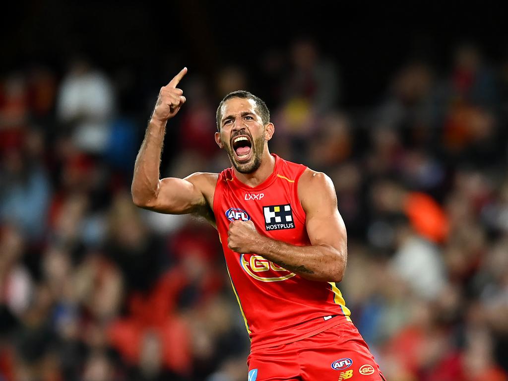 Ben Long celebrates kicking a goal against Essendon. Picture: Albert Perez/AFL Photos via Getty Images.