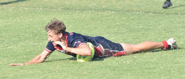 Fullback Seth Carpenter goes in for Emmaus's fourth try.