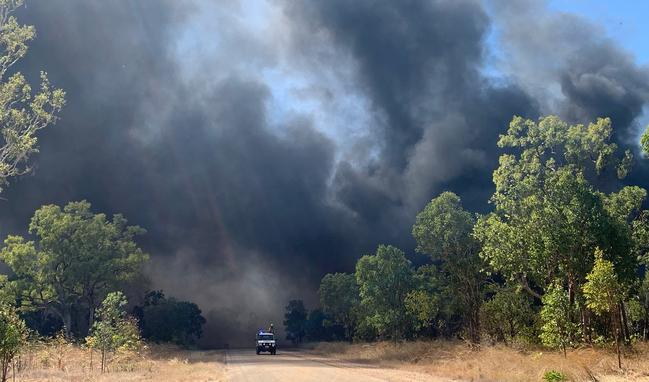 A fire near the Bicentennial Rd at Katherine spread to the area at the rear of the Katherine Showgrounds yesterday, igniting a wall of tyres located on the boundary of the site. Picture: NT Police