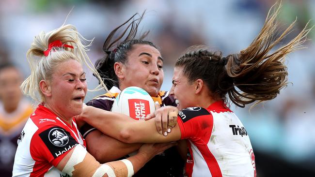 Broncos Annette Brander tackled by Dragons Keeley Davis and Jessica Sergis, right, during last year’s NRLW Grand Final.