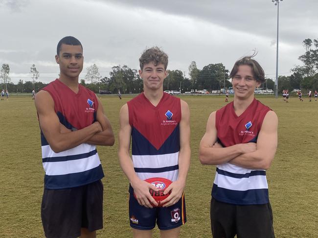 St Andrew's Anglican College senior boys players Jacob Hughes, Jaxon Woodward and Jesh Morgan get ready for a day of play in the AFLQ Secondary Schools Cup.