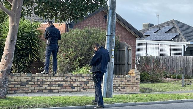 Police at the St Albans home where an alleged carjacker spent more than 13 hours hiding on the roof. Picture: Liam Beatty