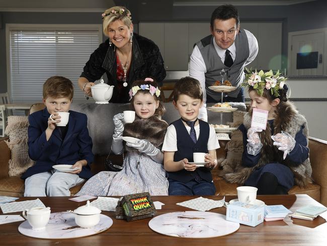 Finding new ways to encourage vocabulary development and spelling skills helps engage children’s imagination and interest while allowing parents to avoid reliving their own days of rote learning. Mum Samantha Taylor and dad Stuart Taylor host high tea at home with their four kids Oscar, 10, Bella, 4, Charlie, 7, and Jazmine, 8. Picture: Alex Coppel.