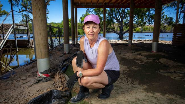 Sue Cornish cleaning up after the flooding Murray River water inundated her property on Providence Drive, Bowhill, SA. Picture Emma Brasier