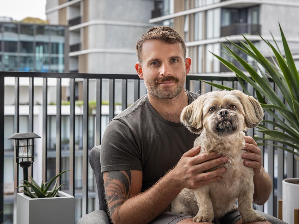 Rob Goddard with pet Bentley at his home in the development Waterfall. Picture: Supplied