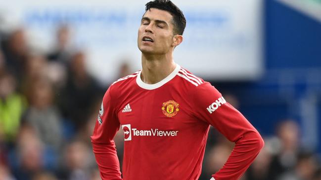 Manchester United's Portuguese striker Cristiano Ronaldo reacts during the English Premier League football match between Brighton and Hove Albion and Manchester United at the American Express Community Stadium in Brighton, southern England on May 7, 2022. (Photo by Glyn KIRK / AFP) / RESTRICTED TO EDITORIAL USE. No use with unauthorized audio, video, data, fixture lists, club/league logos or 'live' services. Online in-match use limited to 120 images. An additional 40 images may be used in extra time. No video emulation. Social media in-match use limited to 120 images. An additional 40 images may be used in extra time. No use in betting publications, games or single club/league/player publications. /