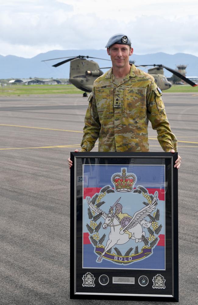 Former Fifth Aviation Regiment Commanding Officer Lieutenant Andrew Lean with the regiment flag presented to him by the regiment's soldiers. Picture: Evan Morgan