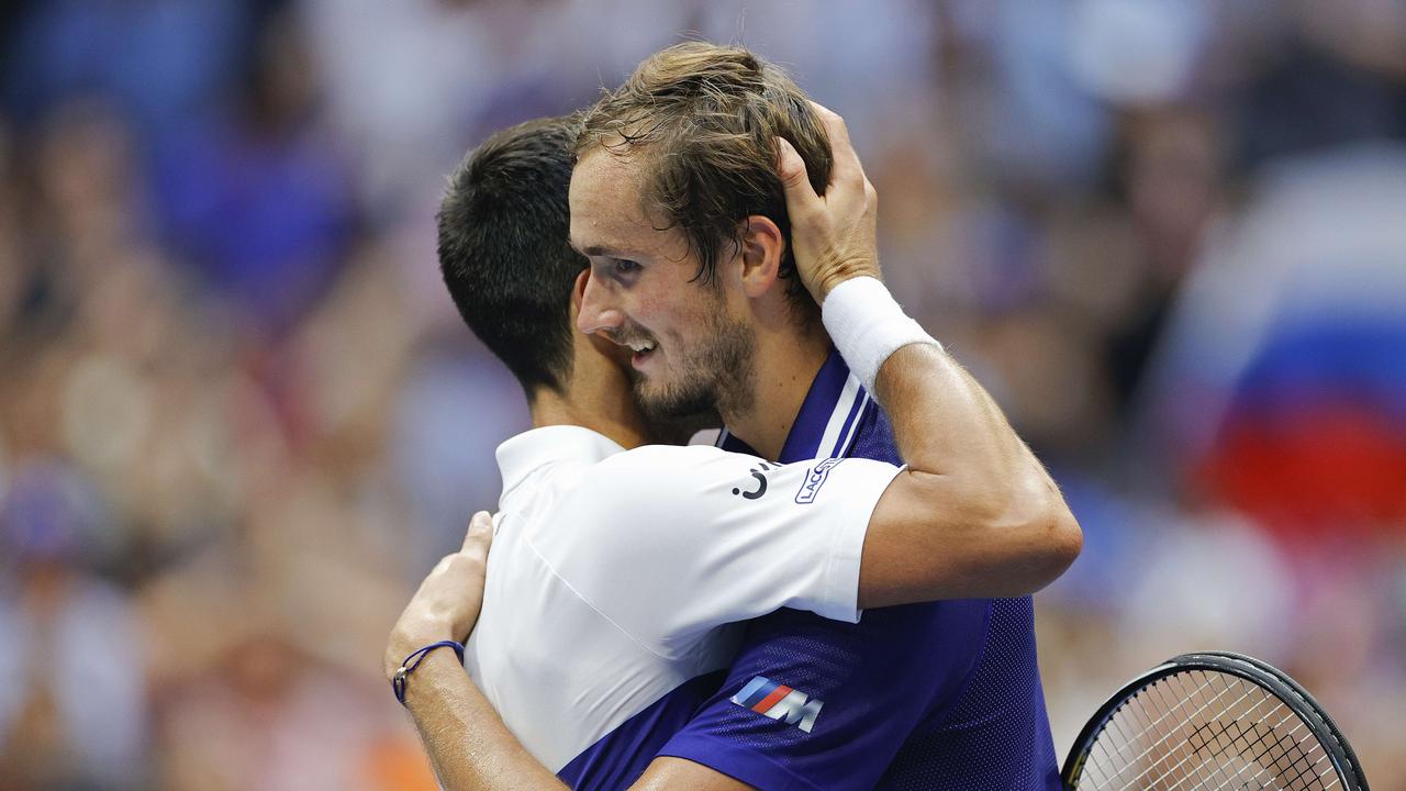 NEW YORK, NEW YORK - SEPTEMBER 12: Daniil Medvedev (R) of Russia and Novak Djokovic (L) of Serbia talk at center court after Medvedev won their Men's Singles final match on Day Fourteen of the 2021 US Open at the USTA Billie Jean King National Tennis Center on September 12, 2021 in the Flushing neighborhood of the Queens borough of New York City. Sarah Stier/Getty Images/AFP == FOR NEWSPAPERS, INTERNET, TELCOS &amp; TELEVISION USE ONLY ==