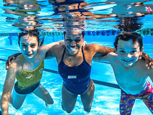 HOLDING FOR THE COURIER MAIL ONLY -  8 years to go to the Brisbane 2032 Olympics and Paralympics. 16-year-old Para Swimmer Victoria Belando Nicholson (middle) with swimmers Maggie Butler, 11 and Jake MacDonald, 10 (**** OUTSIDE SWIMMERS ARE NOT PARA*** ONLY VICTORIA IN THE MIDDLE IS ** )who will be potential athletes at the games.Picture: Nigel Hallett