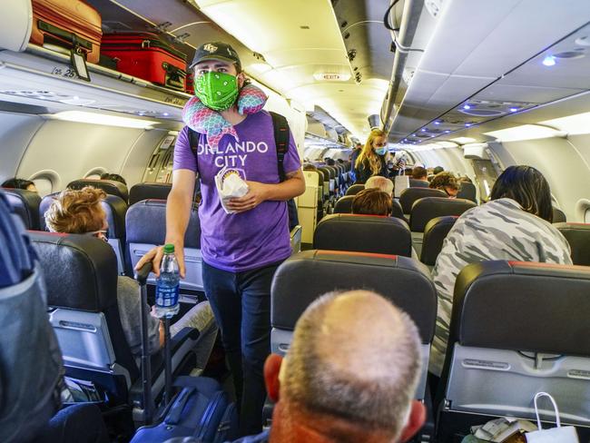 Passengers board an American Airlines flight at San Diego International Airport. Picture: Getty Images.