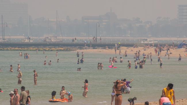 St Kilda beach is shrouded in smoke while the CBD is nearly invisible. Picture: Jason Edwards.