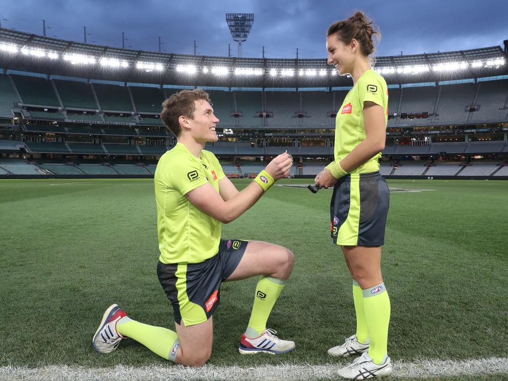 Dillon Tee asks Eleni Glouftsis to marry him after the match between Carlton and Adelaide at the MCG. Picture: David Crosling