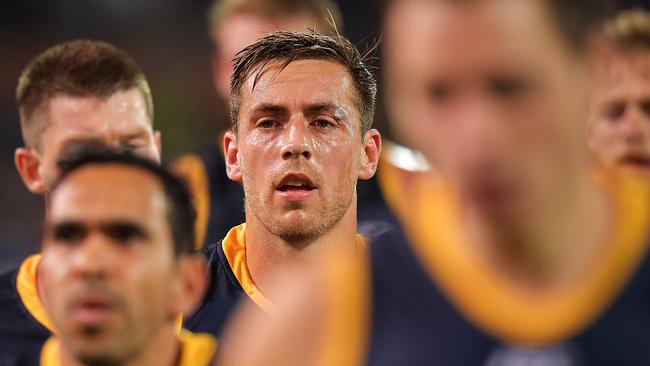 Richard Douglas and his shellshocked teammates leave the field at half time on Friday night. Picture: Daniel Kalisz/Getty Images