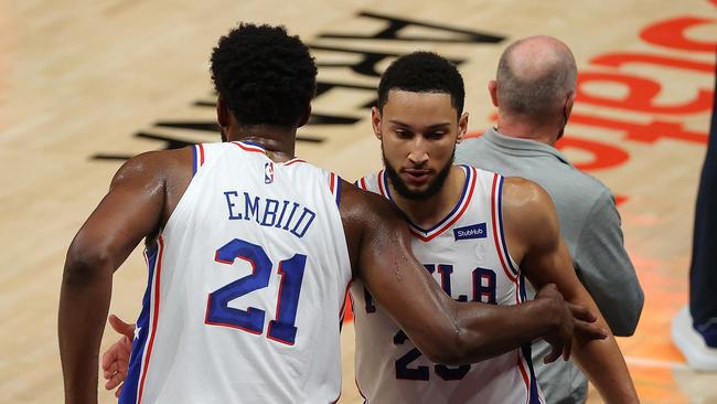 ATLANTA, GEORGIA - JUNE 11: Joel Embiid #21 and Ben Simmons #25 of the Philadelphia 76ers hug after being taken out of the game in the final minutes of their 127-111 win over the Atlanta Hawks in game 3 of the Eastern Conference Semifinals at State Farm Arena on June 11, 2021 in Atlanta, Georgia. NOTE TO USER: User expressly acknowledges and agrees that, by downloading and or using this photograph, User is consenting to the terms and conditions of the Getty Images License Agreement. (Photo by Kevin C. Cox/Getty Images)