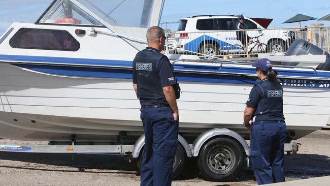 Senior Fisheries Officer Troy Harris and Fisheries Officer Renee Tietzel at West Beach boat ramp, South Australia. Picture: Emma Brasier