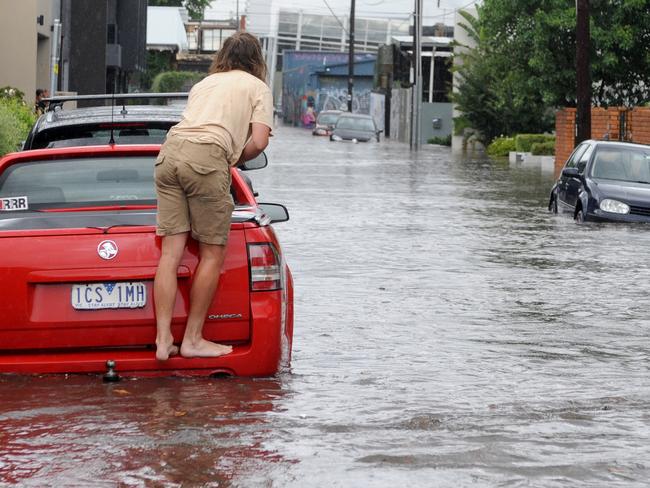 Glass Street in Richmond floods after heavy rains. Picture: Andrew Henshaw