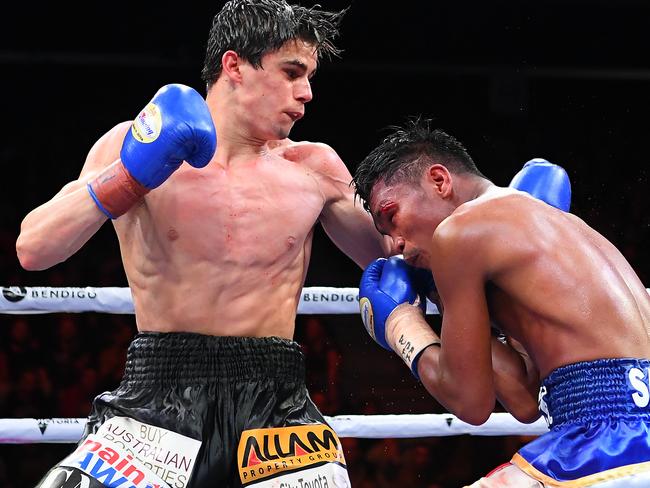 Jarvis lands a punch to Ernesto Sailing during their super bantamweight bout in Bendigo.