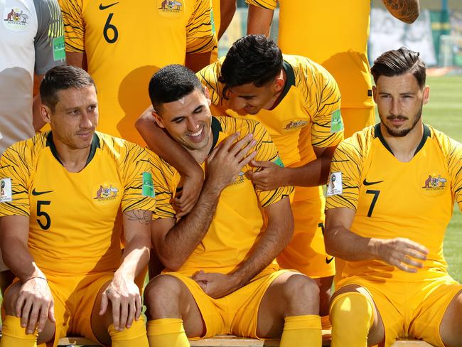 Arzani clowns around with Tom Rogic (centre) during a Socceroos media opportunity in Kazan, Russia, yesterday. Picture: Getty Images