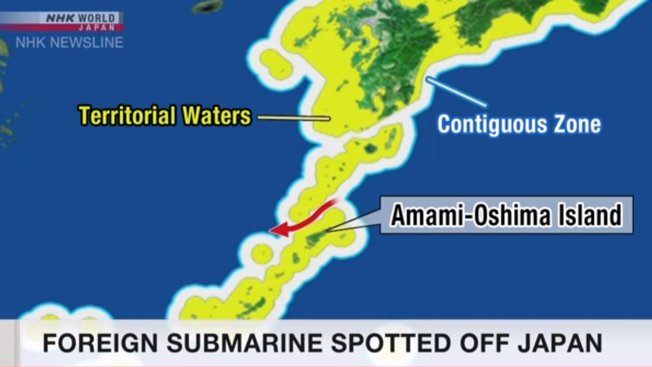 A screen grab of NHK Newsline story about a submarine being spotted off Japan.