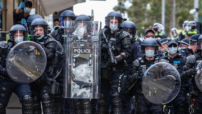 Police fend off the crowd of Freedom Rally protestors in the CBD. Picture: NCA NewsWire/Sarah Matray