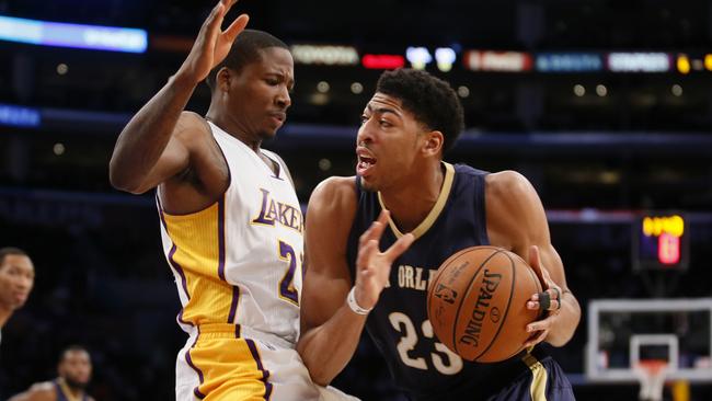 New Orleans Pelicans' Anthony Davis drives against Los Angeles Laker Wayne Ellington.