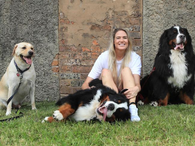 11/2/22: Netball star Caitlin Bassett with her dog Chino plus Giulio and Andre that she is looking after. Caitlin is announcing her retirement from netball. John Feder/The Australian.