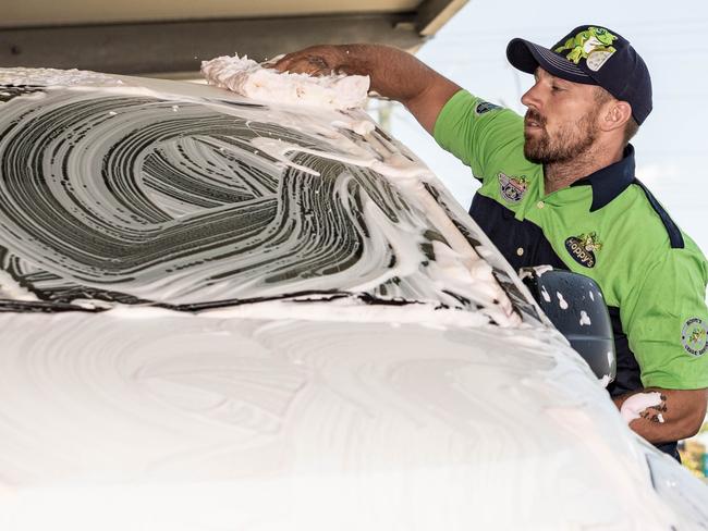 Supplied image of Gold Coast Titans players Phillip Sami (left) and Bryce Cartwright (right) washing cars