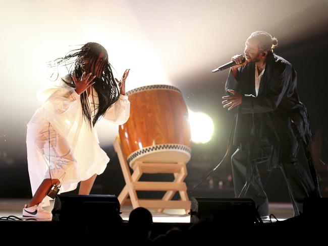 Kendrick Lamar, right, performs at the 60th annual Grammy Awards. Picture: AP