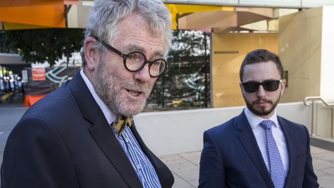 Former QUT student Calum Thwaites (right) and lawyer Tony Morris QC leave the Federal Court in Brisbane. Photo: Glenn Hunt