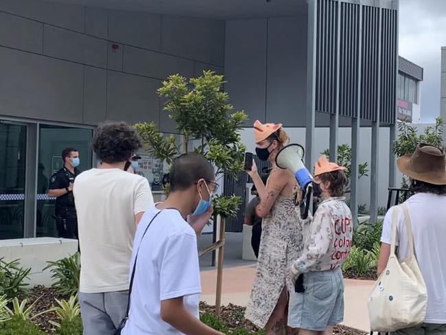 Protesters gather outside the newly opened West End Police Station in Brisbane.