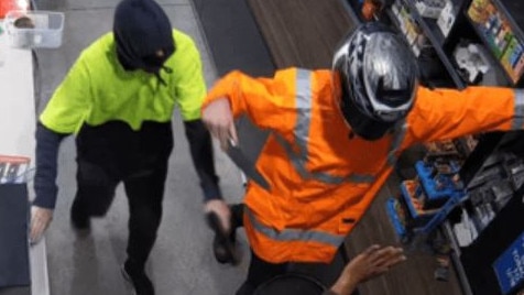 Police have released images of two men who robbed a Maidstone service station. Picture: Supplied