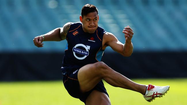 Israel Folau kicks during a Waratahs captains run at Allianz Stadium, Sydney.