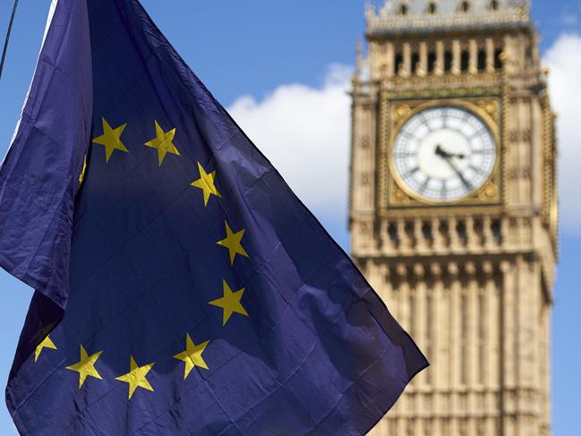 A European flag is flown in front of The Elizabeth Tower which houses the "Big Ben" bell in the Palace of Westminster, as thousands of protesters gather in Parliament Square as they take part in a March for Europe, through the centre of London on July 2, 2016, to protest against Britain's vote to leave the EU, which has plunged the government into political turmoil and left the country deeply polarised. Protesters from a variety of movements march from Park Lane to Parliament Square to show solidarity with those looking to create a more positive, inclusive kinder Britain in Europe. / AFP PHOTO / Niklas HALLE'N