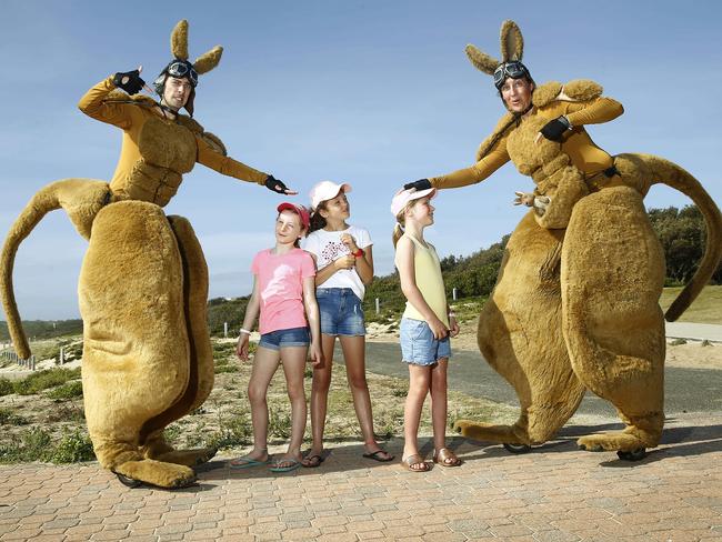 Hugh Roo and Jillaroo at Maroubra Beach with (from left) Isla Freeman, 9, Katherine Lewis, 9, and Lily Freeman, 8. Picture: John Appleyard
