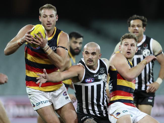 AFL - SHOWDOWN 48 - Port Adelaide v Adelaide Crows at the Adelaide Oval. Daniel  Talia under pressure from Sam Powell Pepper with Rory Laird Picture SARAH REED