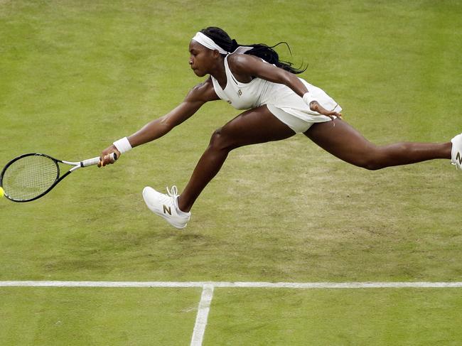 United States' Cori "Coco" Gauff returns to Slovakia's Magdalena Rybaikova in a Women's singles match during day three of the Wimbledon Tennis Championships in London, Wednesday, July 3, 2019. (AP Photo/Tim Ireland)