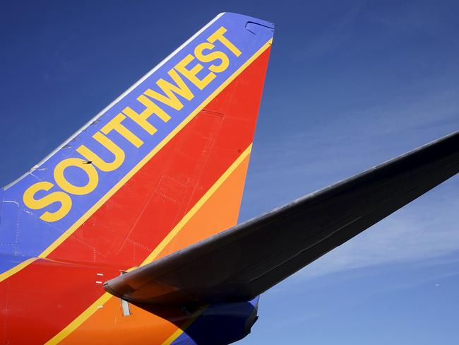 A Southwest Airlines jet waits on the tarmac at Denver International Airport in Denver in this January 22, 2014 file photo. Southwest is to release their Q3 results on October 22, 2015. REUTERS/Rick Wilking/FilesGLOBAL BUSINESS WEEK AHEAD PACKAGE - SEARCH "BUSINESS WEEK AHEAD OCTOBER 19" FOR ALL 37 IMAGES