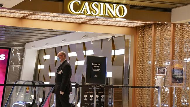 A security guard patrols in front of a closed entrance outside Crown Casino in Melbourne on Monday. Picture: AAP