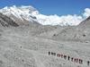 In this May 16, 2020 aerial photo released by Xinhua News Agency, Chinese surveyors hike toward a higher spot from the base camp on Mount Qomolangma at an altitude of 5,200 meters. The Chinese government-backed team plans to summit Mount Everest this week at a time when the world's tallest peak has been closed to commercial climbers. (Jigme Dorje/Xinhua via AP)