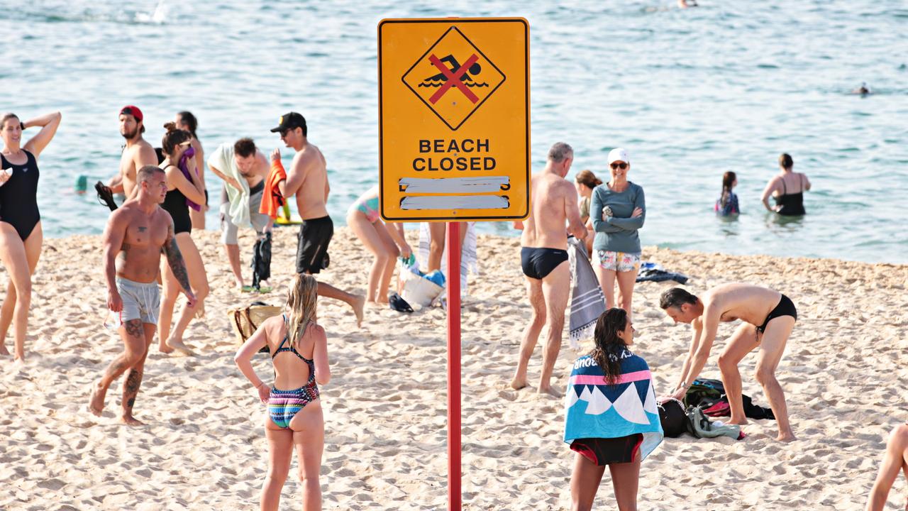 Large crowds leaving Coogee beach after 9am closure on Sunday. Picture: Adam Yip