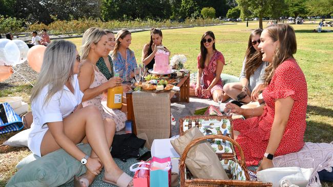 A group of women are seen celebrating a birthday in New Farm Park. Picture: AAP Image/Darren England