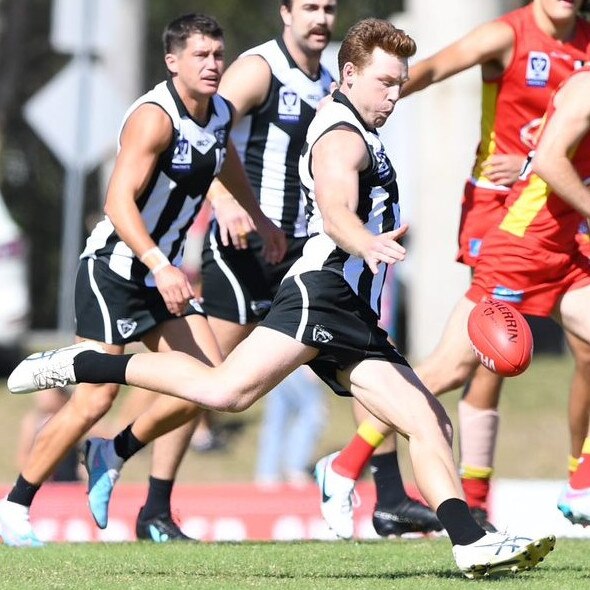 Jesse Joyce kicks for Southport Sharks. Credit: Highflyer Images